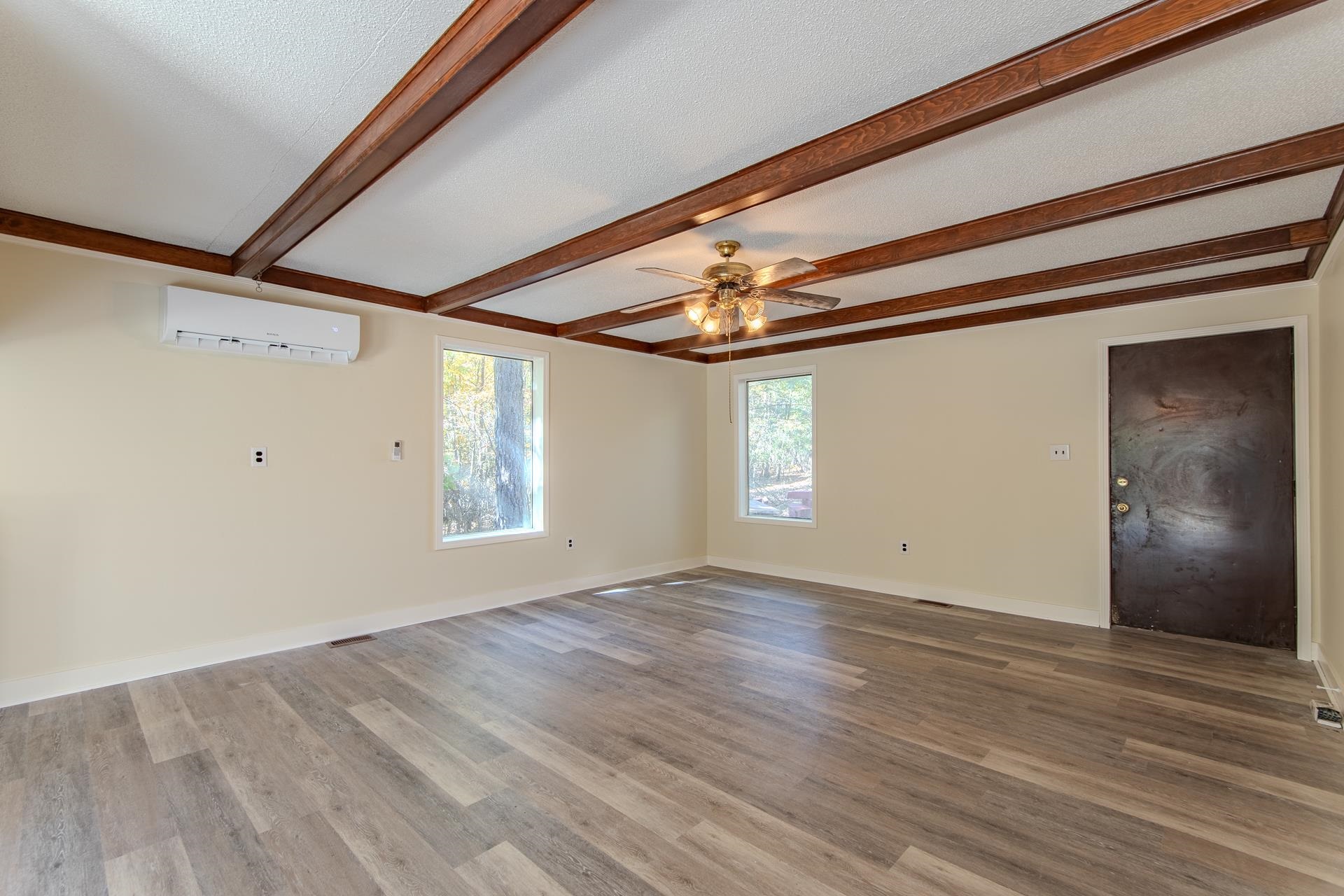 35 Trail Lane Savannah, TN 38372 - Photo 14 of 39 a view of an empty room with wooden floor and a window