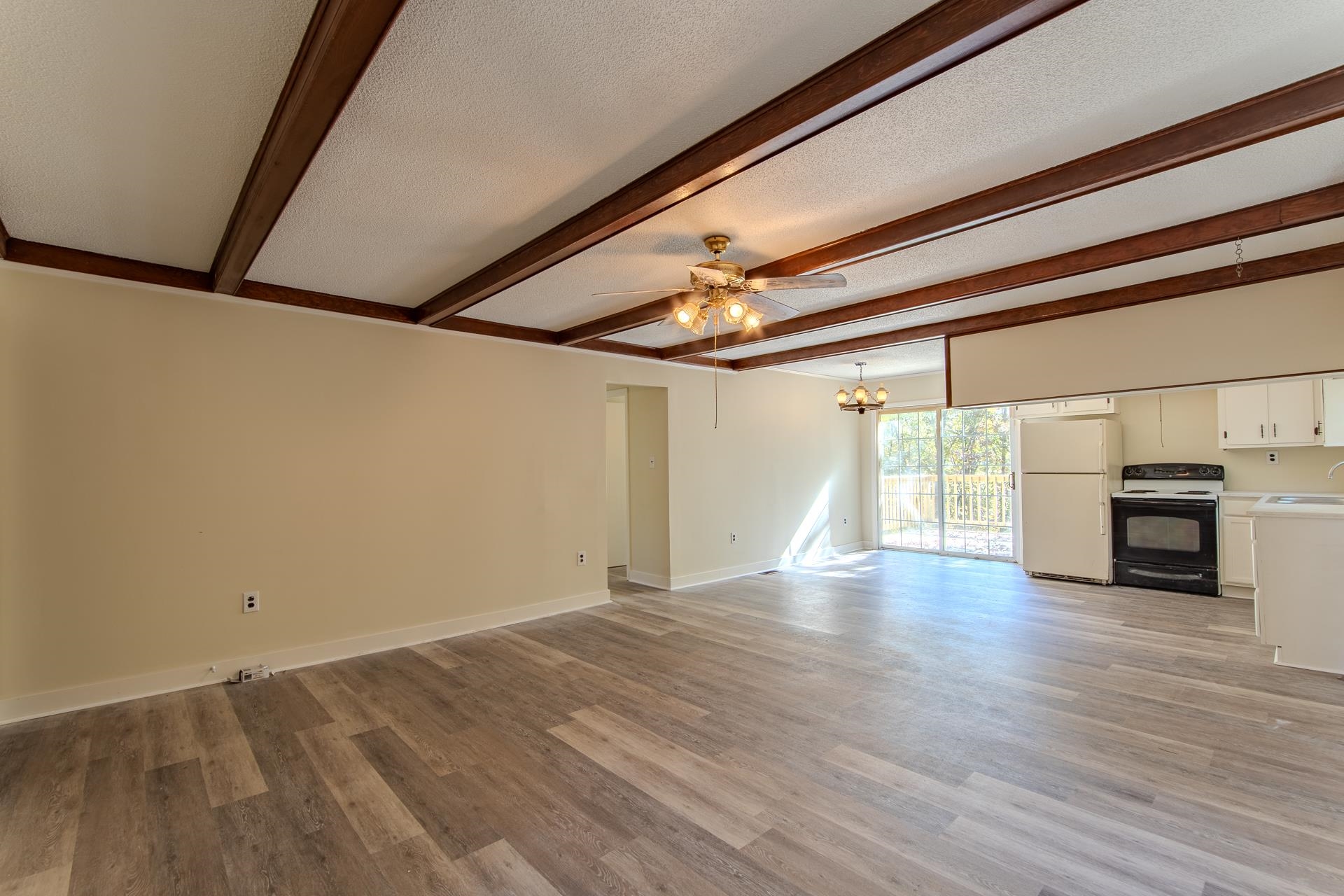 35 Trail Lane Savannah, TN 38372 - Photo 10 of 39 a view of empty room with wooden floor and fireplace