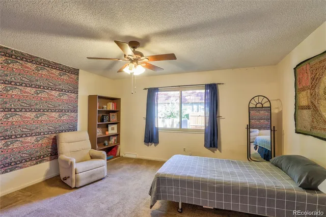 a bedroom with a bed furniture and a window