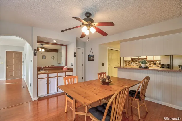 a view of a dining room with furniture and wooden floor