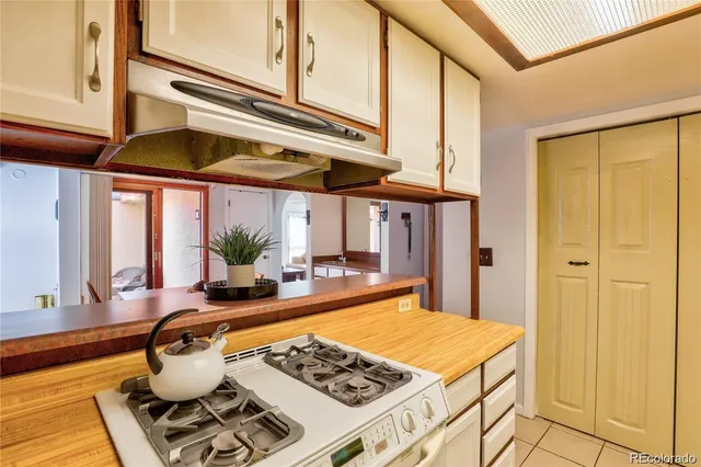 a kitchen with a stove and a refrigerator