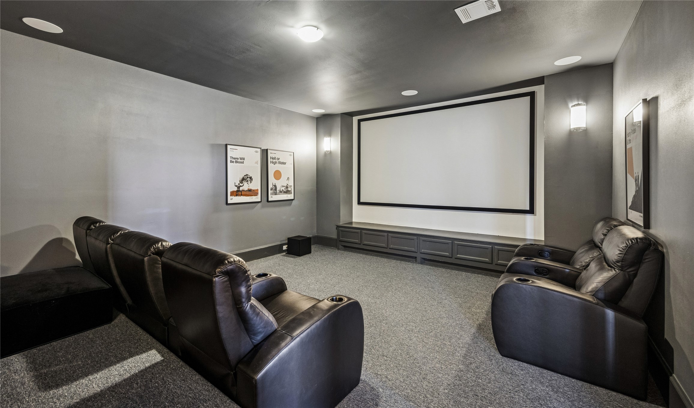 610 East 7th Street Houston, TX 77007 - Photo 29 of 40 THEATER ROOM ON THE THIRD FLOOR FEATURES TWO LEVELS OF SEATING (BACK ROW NOT PICTURED), SURROUND SOUND AND A PROJECTOR SCREEN.