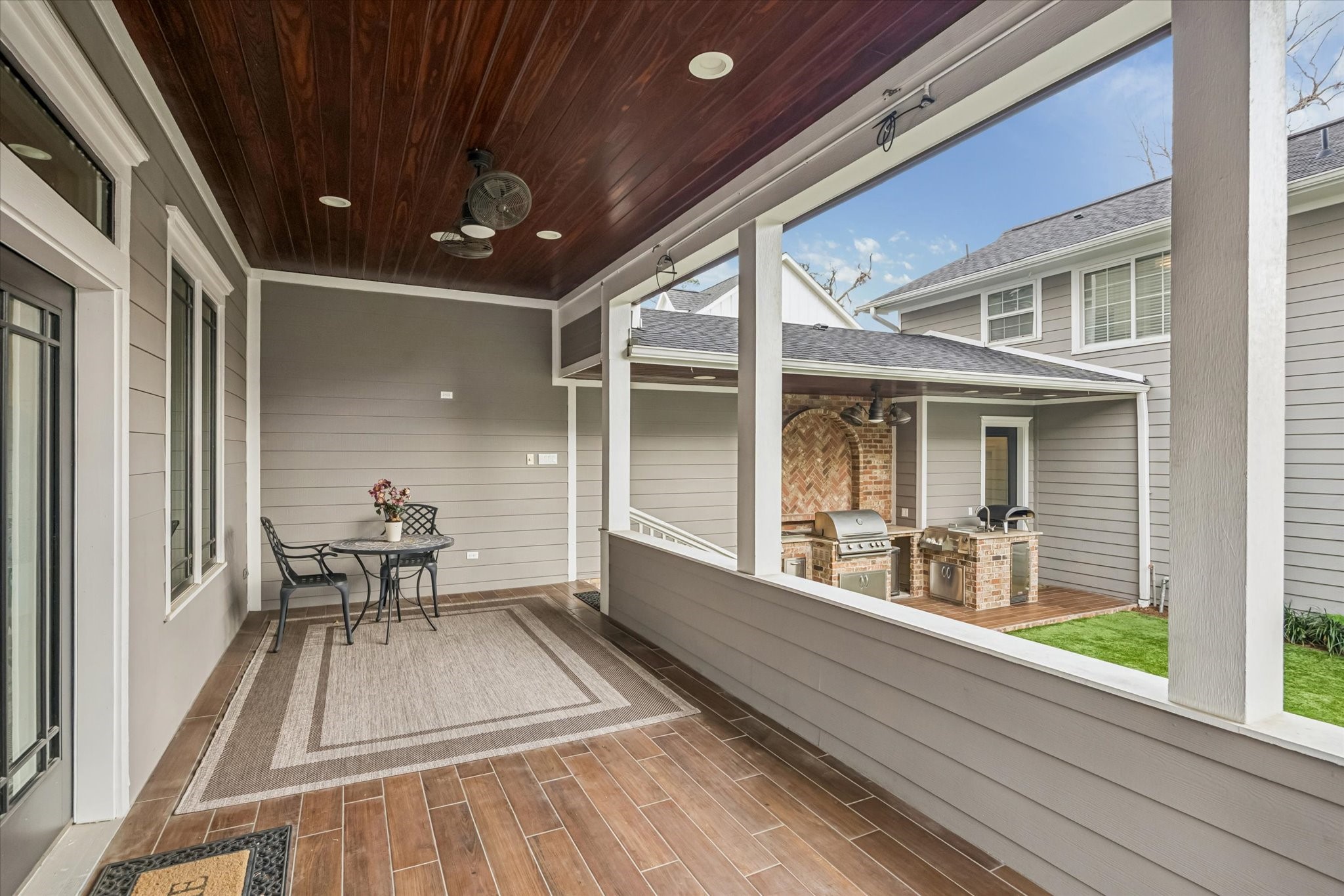 610 East 7th Street Houston, TX 77007 - Photo 36 of 40 ACCOMMODATING COVERED PORCH OFF THE HOME'S LIVING ROOM HAS PLENTY OF SPACE FOR DINING AS WELL AS A SEPARATE SEATING ARRANGEMENT. JUST A FEW STEPS DOWN TO THE IDEAL OUTDOOR KITCHEN.
