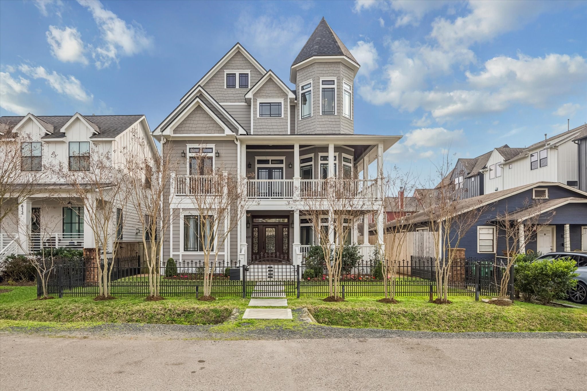 610 East 7th Street Houston, TX 77007 - Photo 40 of 40 BEAUTIFUL CREPE MYRTLES LINE THE HOME'S FACADE JUST OUTSIDE OF THE WROUGHT IRON FRONT GATE.