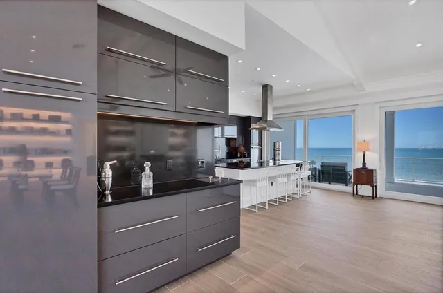 a living room with fireplace furniture and a wooden floor