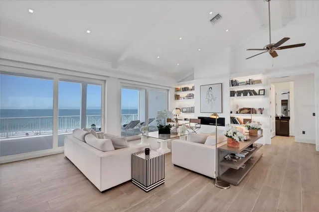 a dining room with stainless steel appliances kitchen island a table and chairs