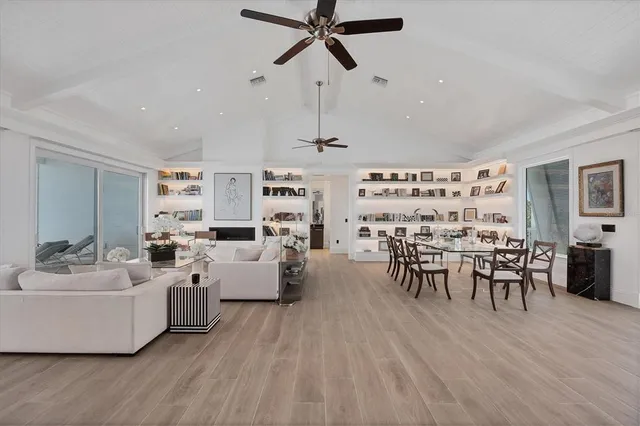 a kitchen with stainless steel appliances kitchen island granite countertop a refrigerator and a stove top oven