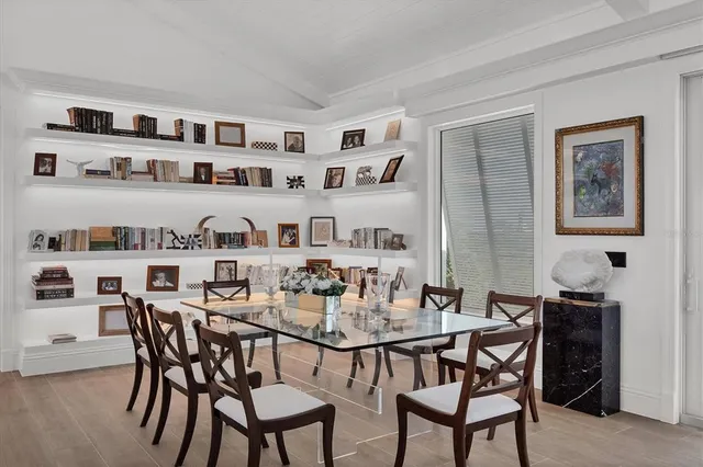 a large kitchen with stainless steel appliances lots of counter space and a sink