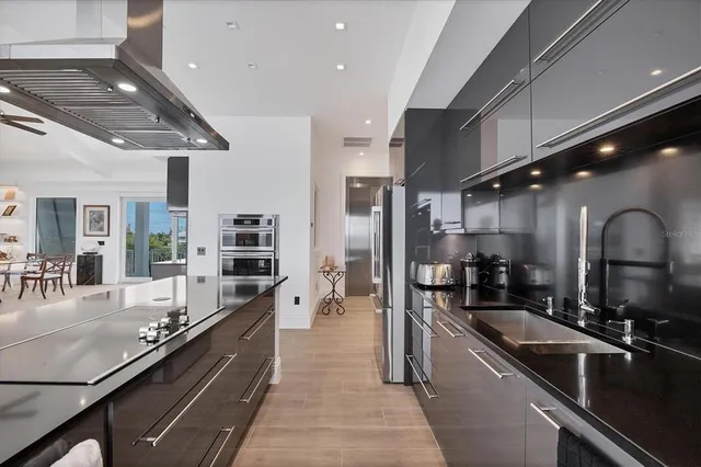 a bedroom with a bed a large window and walk in closet