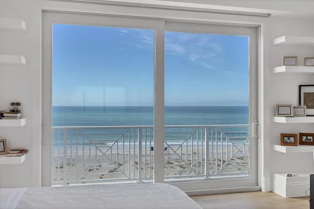 a large kitchen with granite countertop a sink and cabinets