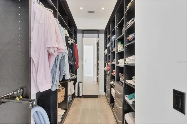 a bathroom with a granite countertop sink a toilet and a mirror