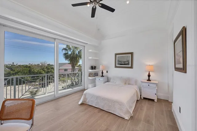 a spacious bedroom with a bed and a large window
