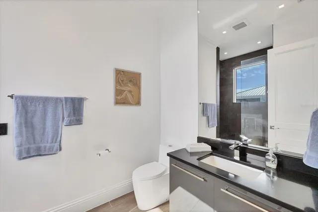 a bedroom with a bed and large window