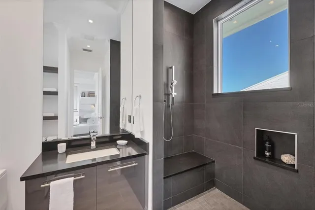 a bathroom with a sink and a mirror