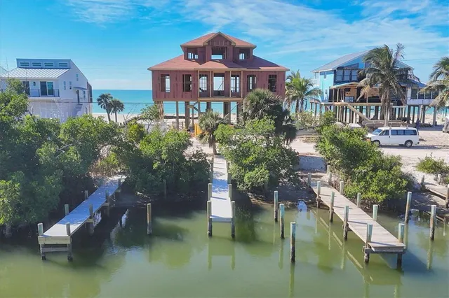 a bathroom with a toilet sink and painting on the wall