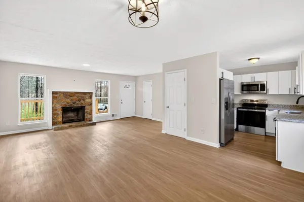 a view of kitchen with furniture and wooden floor