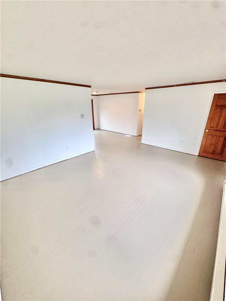 8325 Schantz Road Breinigsville, PA 18031 - Photo 4 of 21 A spacious, naturally illuminated room features light-toned wood flooring and classic wood trim.