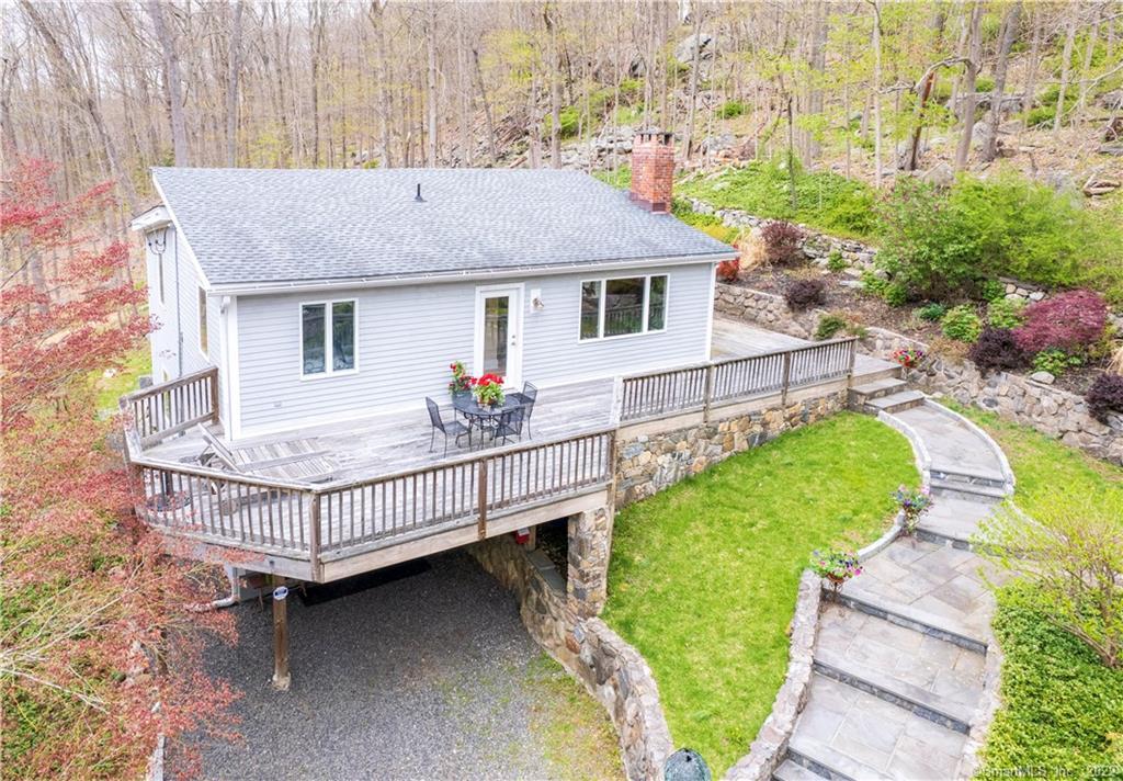 170 Oscaleta Road Ridgefield, CT 06877 - Photo 1 of 1 a front view of a house with garden