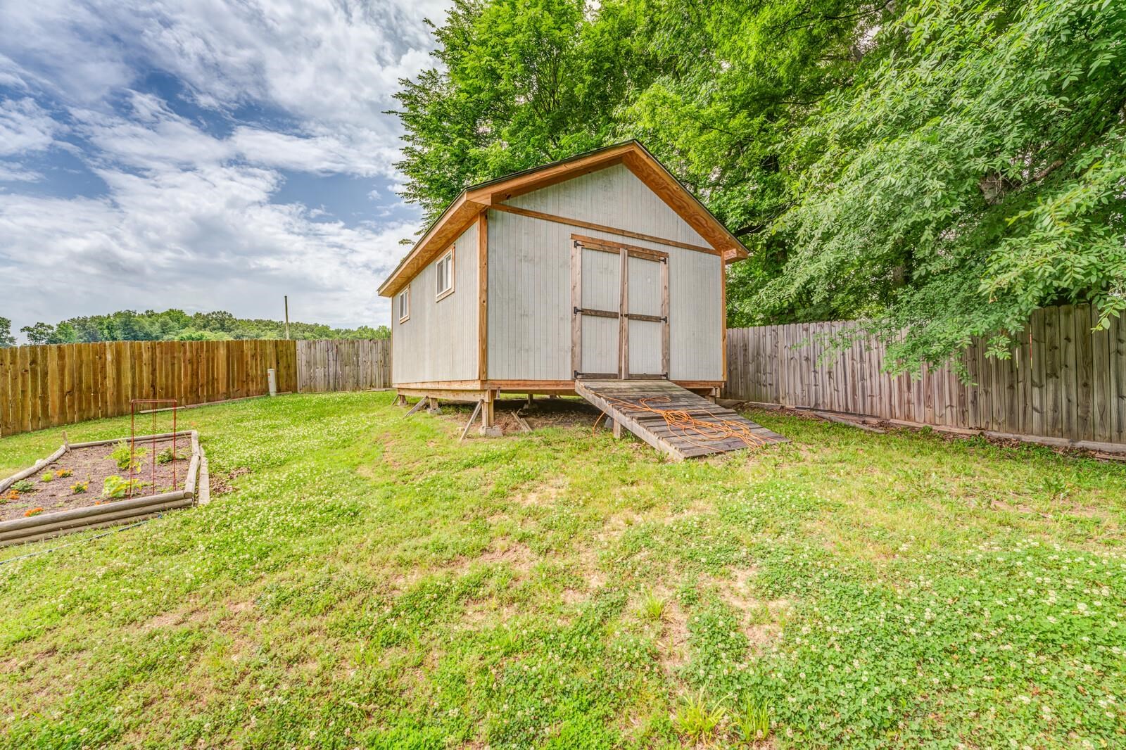 4671 Hampton Ridge Lane Bartlett, TN 38002 - Photo 37 of 40 Detached storage shed with wood trim and double doors