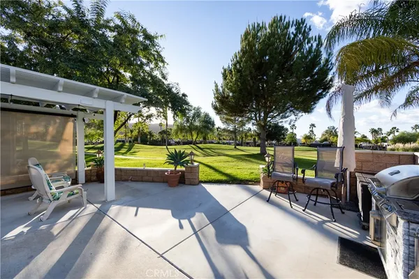 a view of a swimming pool with a patio