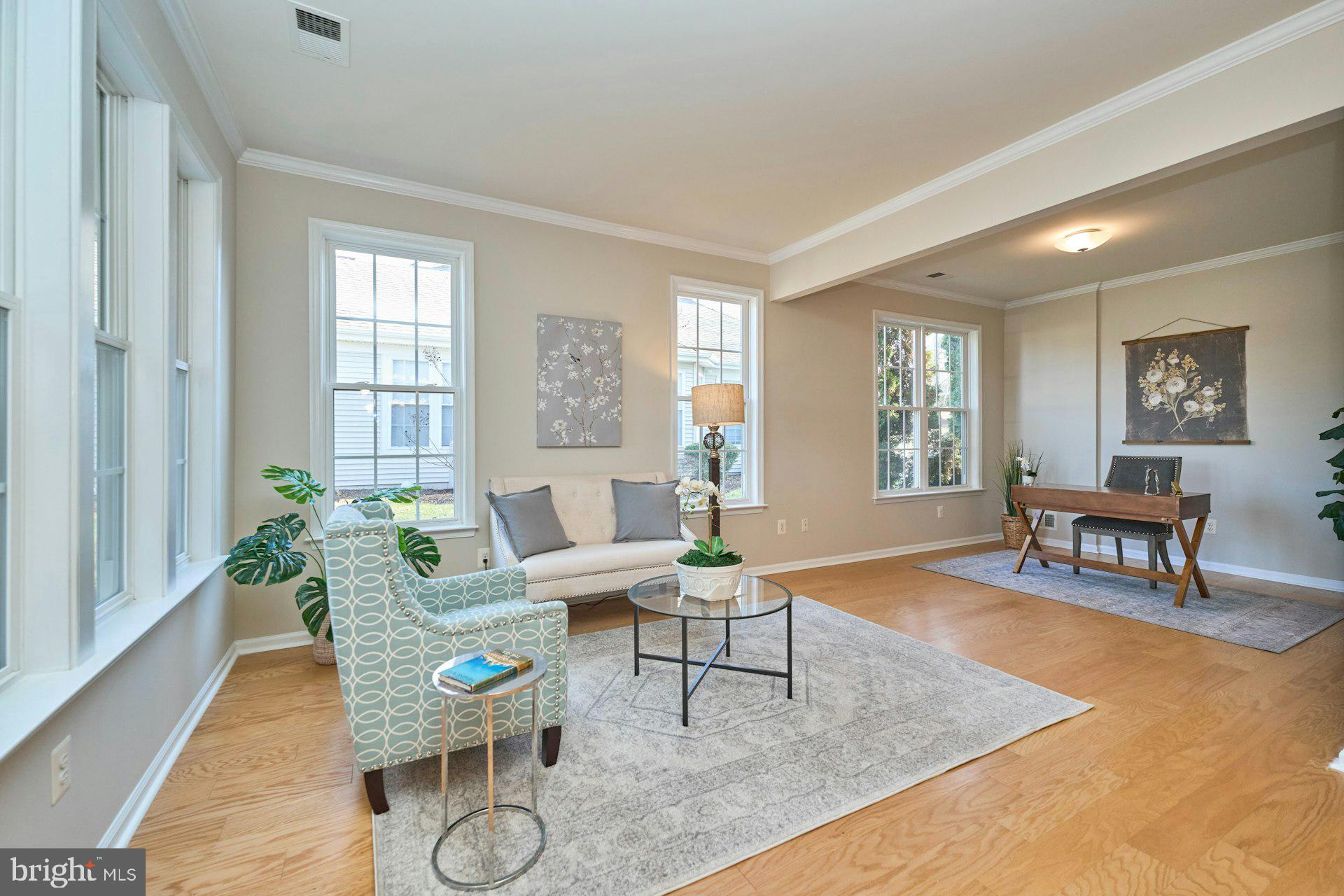 6916 Broadleaf Terrace Gainesville, VA 20155 - Photo 8 of 40 What a comfortable area with wall of windows