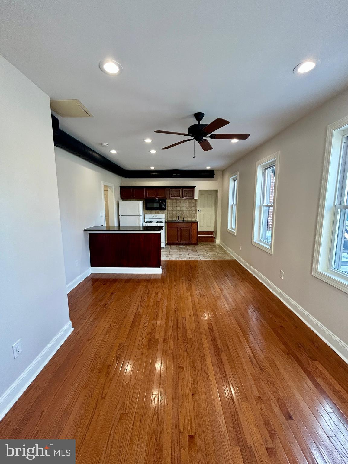 101 Fayette Street, Unit 2 Conshohocken, PA 19428 - Photo 11 of 19 a view of empty room with wooden floor and fan