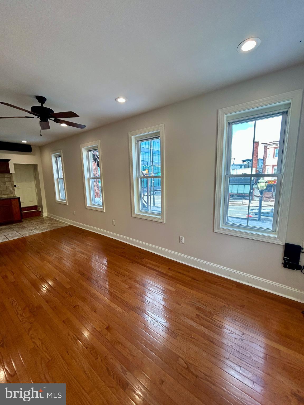 101 Fayette Street, Unit 2 Conshohocken, PA 19428 - Photo 12 of 19 a view of an empty room with window and wooden floor