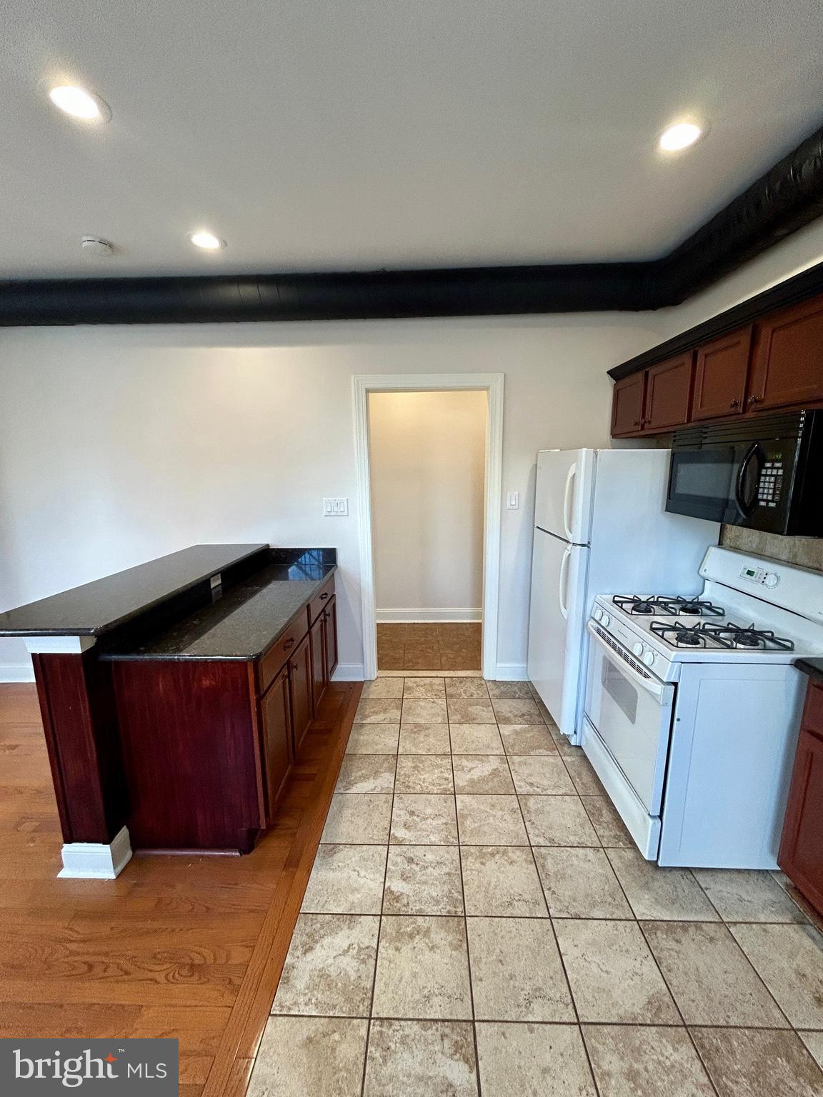 101 Fayette Street, Unit 2 Conshohocken, PA 19428 - Photo 8 of 19 a kitchen with stainless steel appliances granite countertop a stove a sink and a refrigerator
