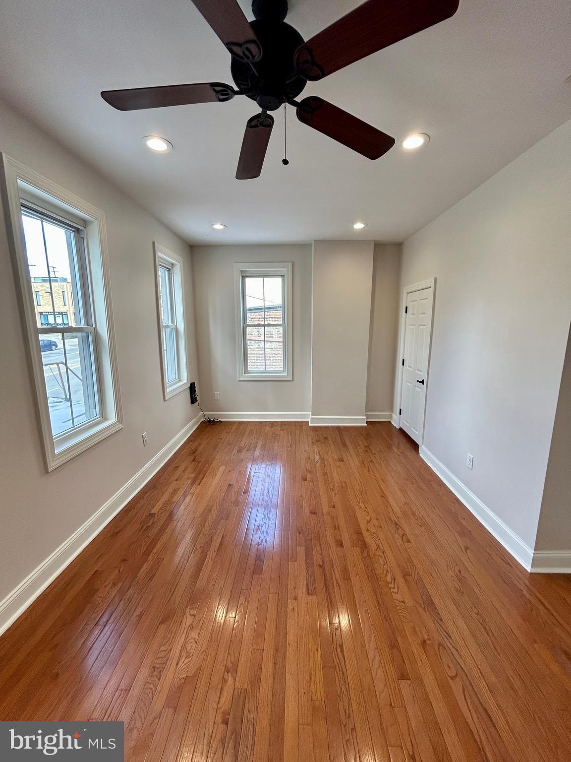 101 Fayette Street, Unit 2 Conshohocken, PA 19428 - Photo 9 of 19 a view of an empty room window and wooden floor