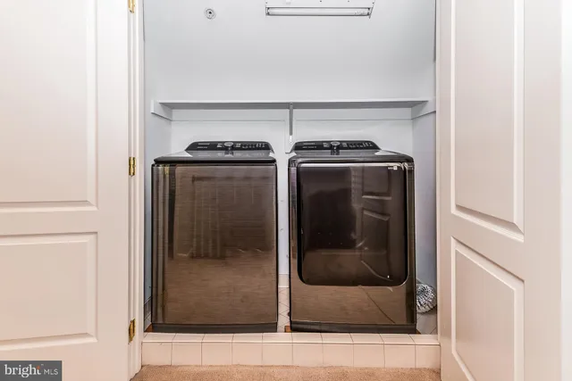 a utility room with washer and dryer