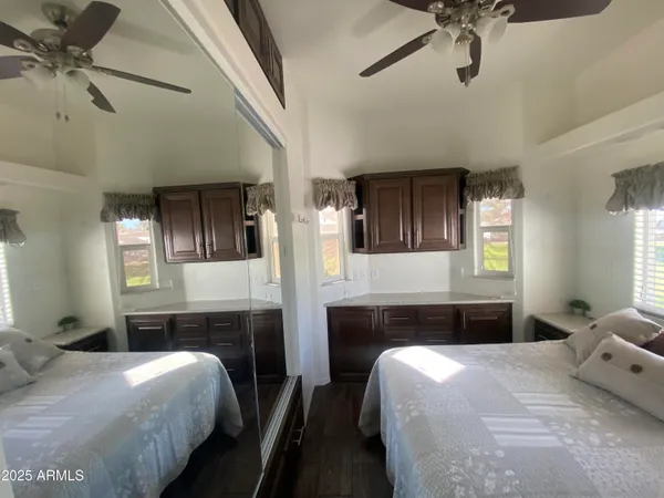 a bedroom with a bed bathroom and a mirror