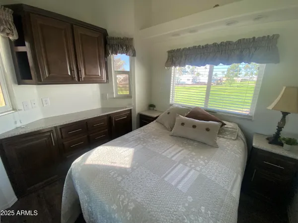 a bedroom with a bed and window