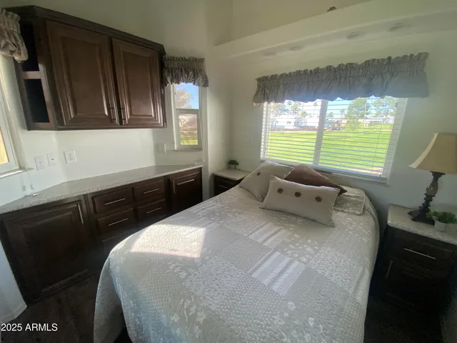 a bedroom with a bed and window