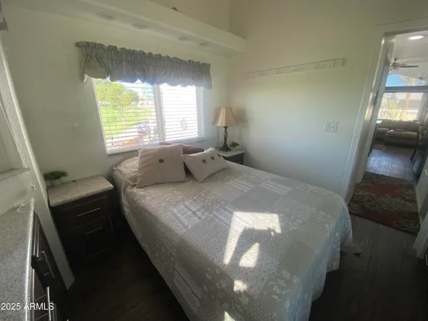 a bedroom with a bed and window