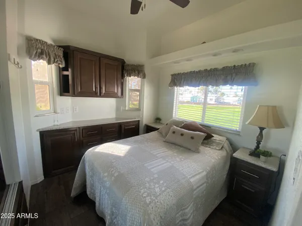 a bedroom with a bed and a lamp