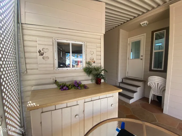 a front view of a house with outdoor seating