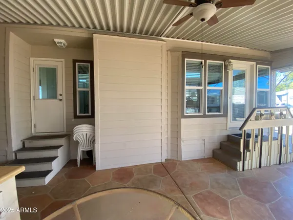 a view of a livingroom with furniture and staircase