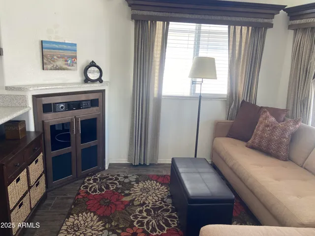 a living room with furniture and a window