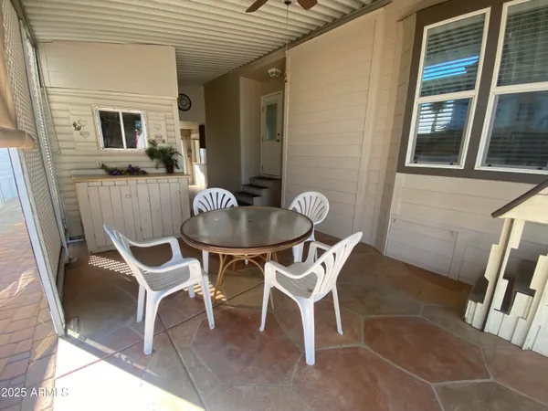 a view of a dining room with furniture wooden floor and a rug