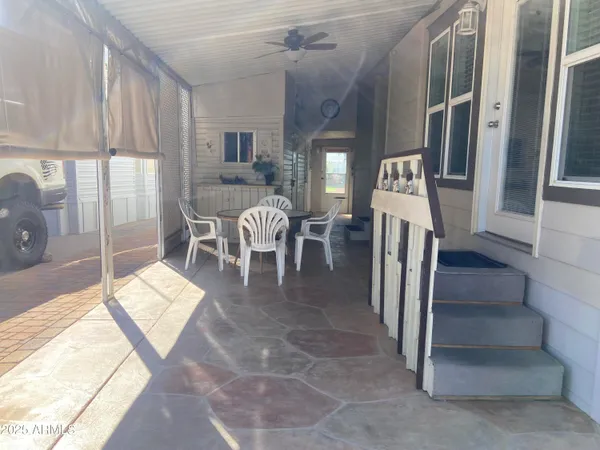 a dining room with furniture and a window