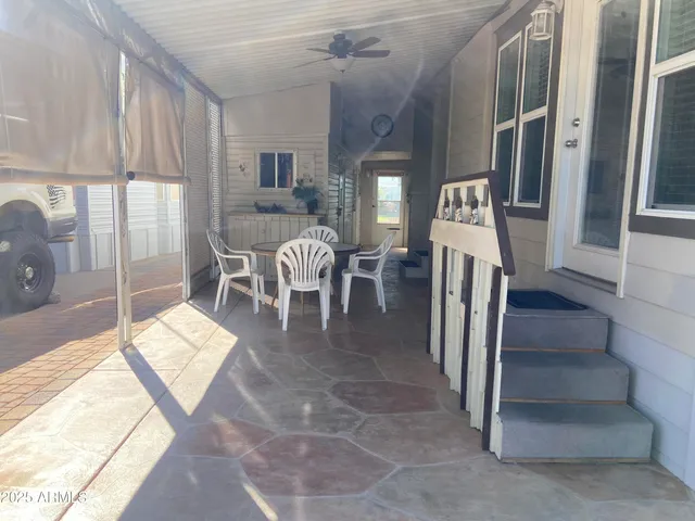 a dining room with furniture and a window