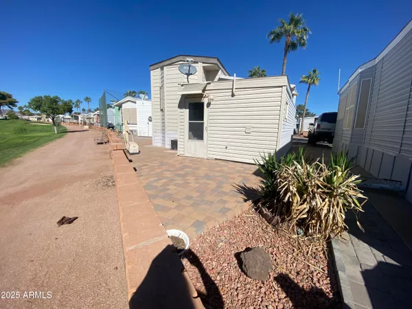a view of a play house with a yard
