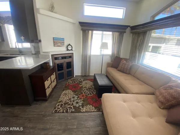 a living room with furniture fireplace and window