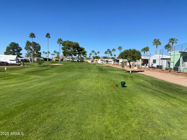 a view of yard with house and car parked
