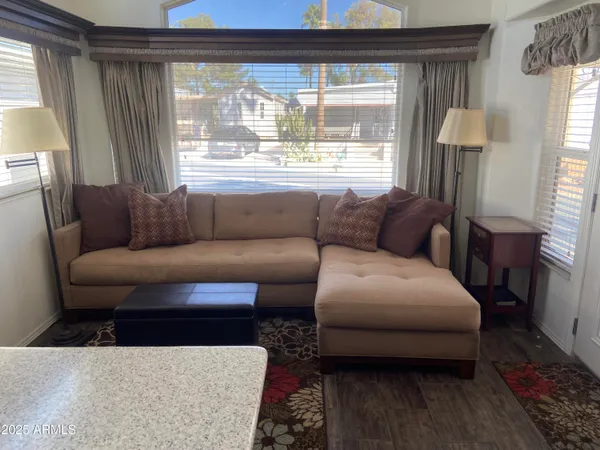 a living room with furniture and a window