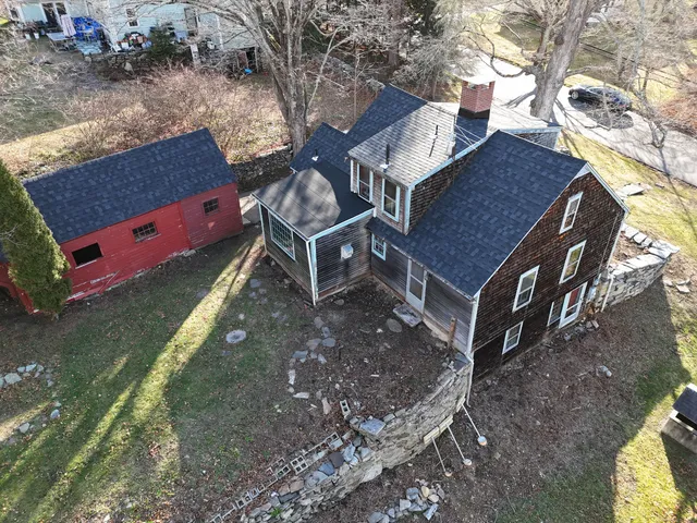 a aerial view of a house with a yard