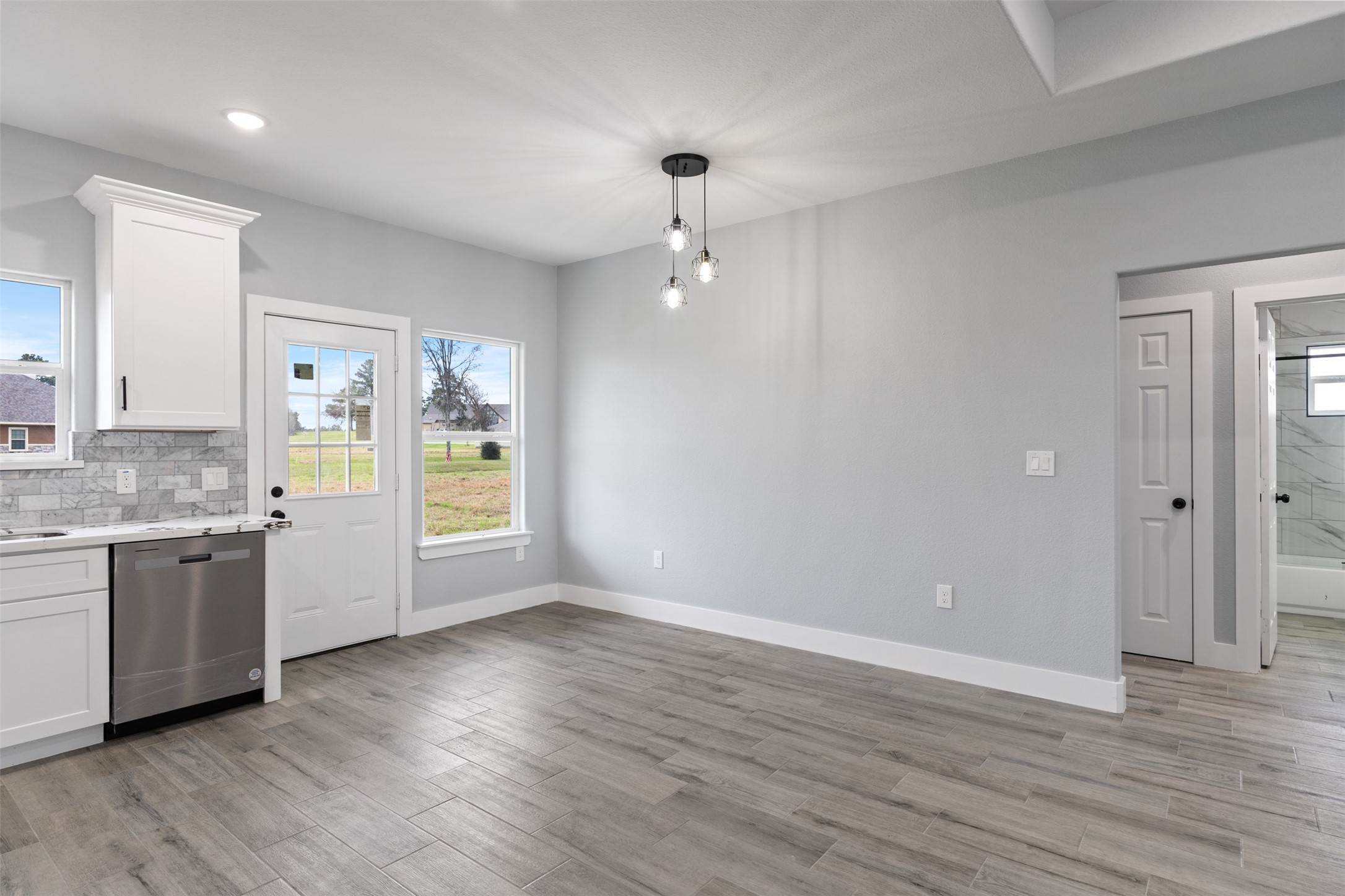 7 Meadowview Drive Trinity, TX 75862 - Photo 12 of 32 a bathroom with a granite countertop sink and a mirror