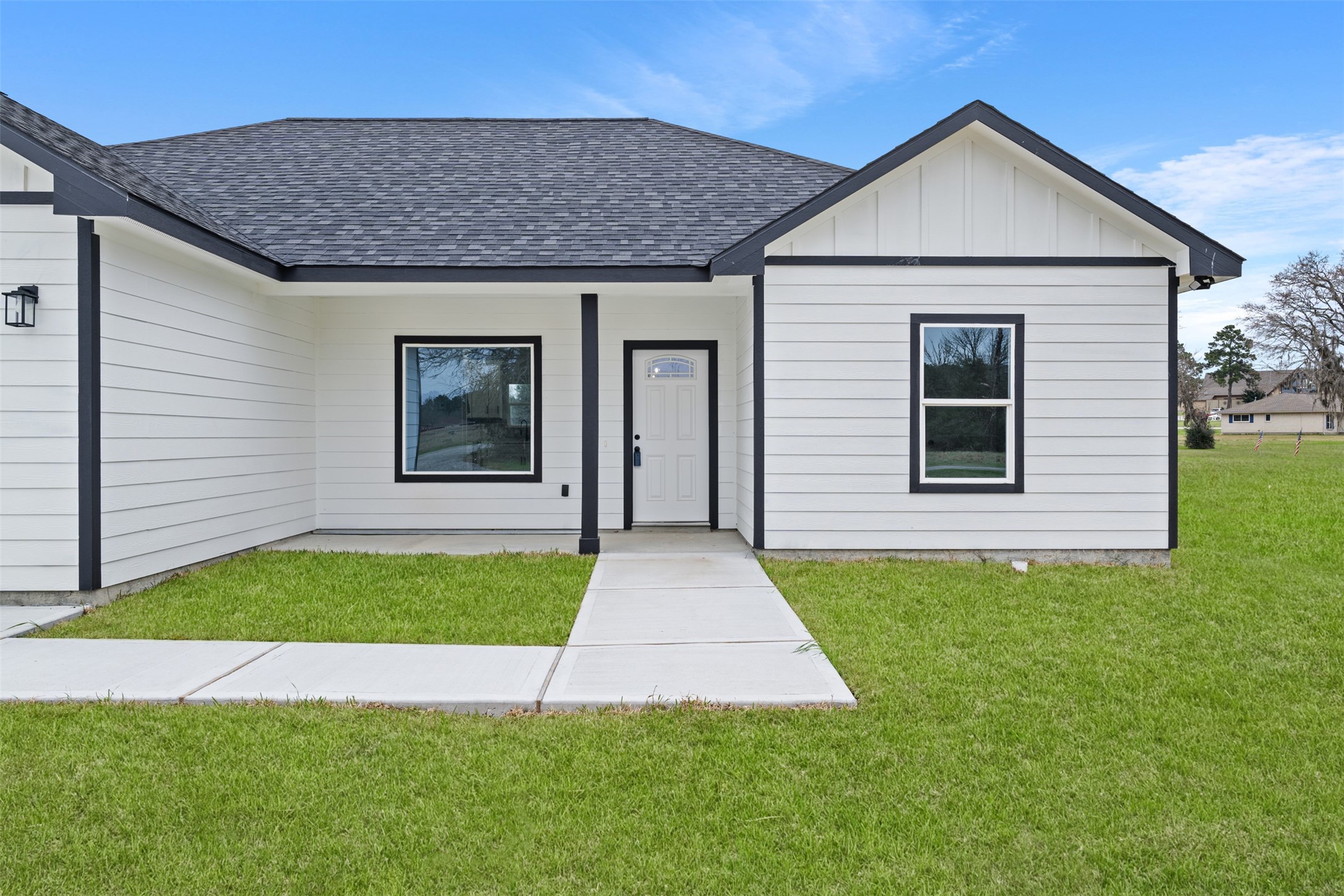 7 Meadowview Drive Trinity, TX 75862 - Photo 4 of 32 a front view of a house with garden