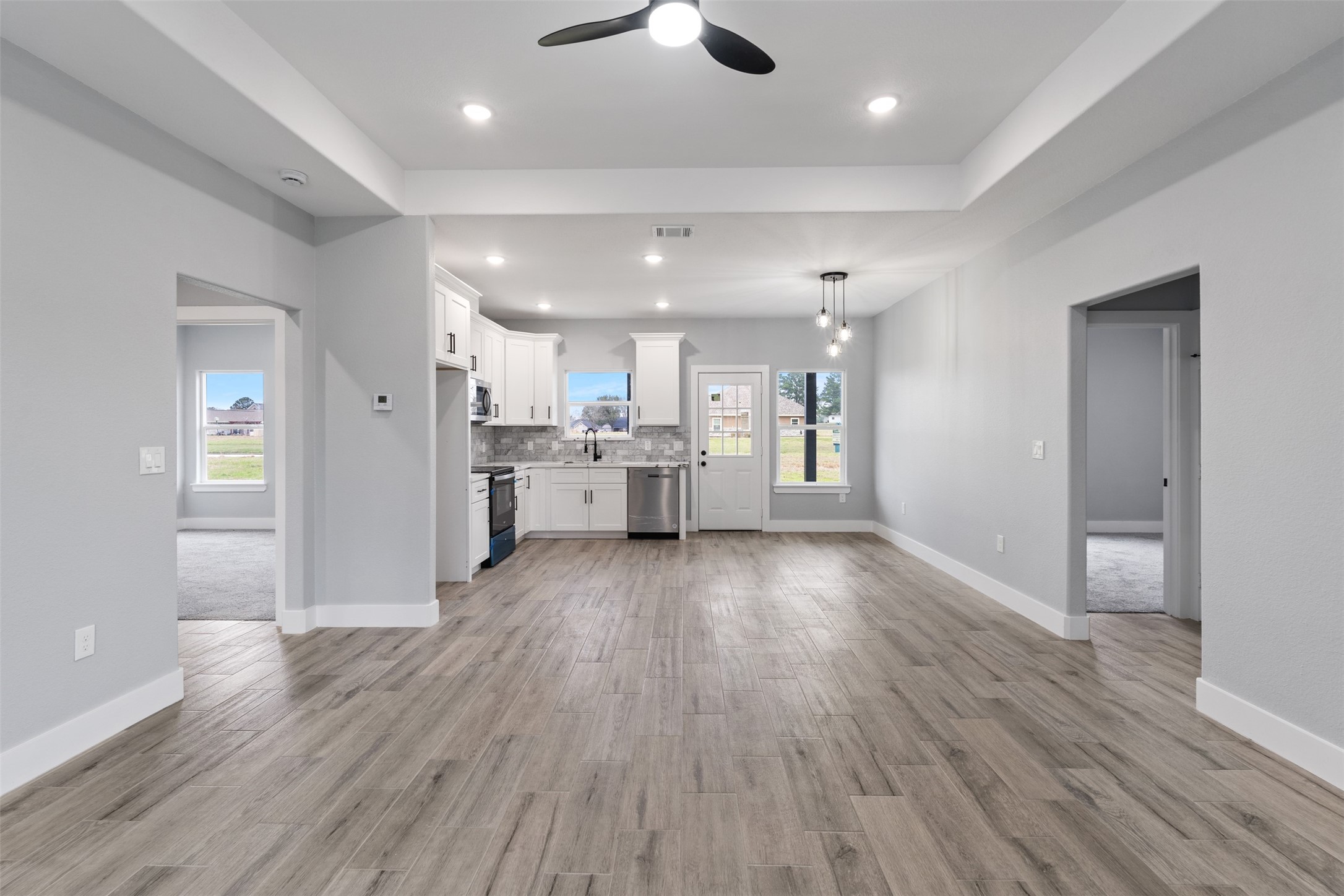 7 Meadowview Drive Trinity, TX 75862 - Photo 9 of 32 a view of kitchen with refrigerator stove and wooden floor
