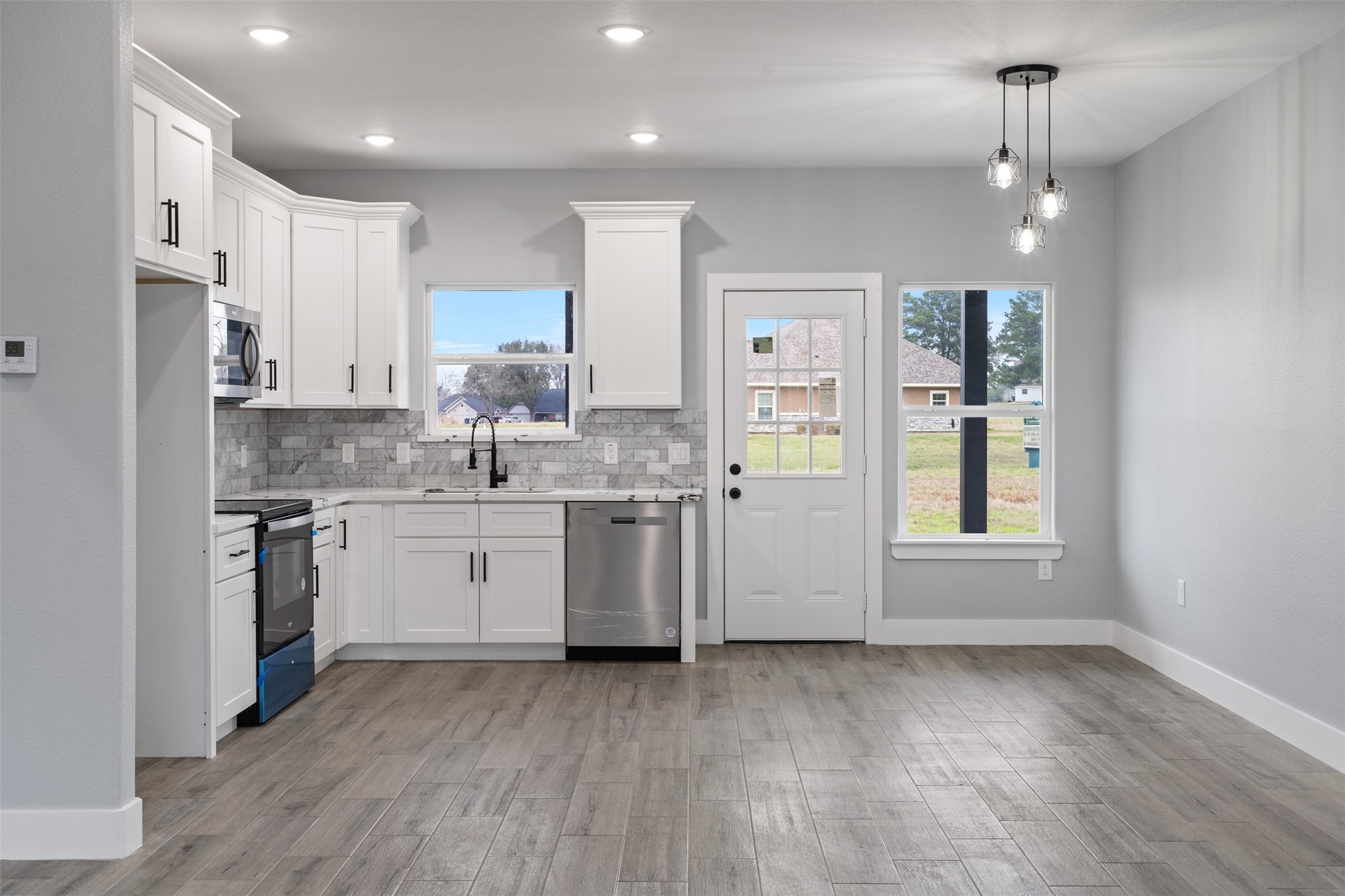 7 Meadowview Drive Trinity, TX 75862 - Photo 10 of 32 a kitchen with a sink cabinets stainless steel appliances and window